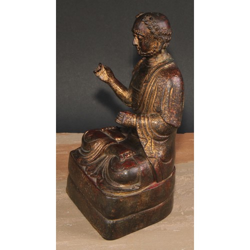 524 - Chinese School, a bronze Buuddha, seated in meditation, traces of gilding, 24cm high