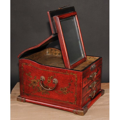 175 - A Chinese red lacquer table top vanity chest, hinged cover enclosing a folding mirror, above three d... 