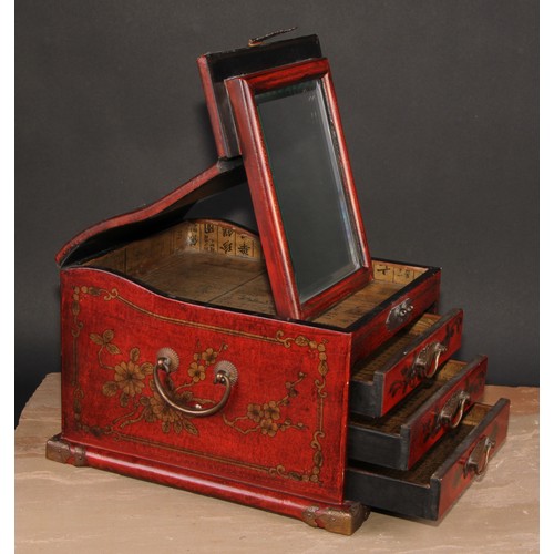 175 - A Chinese red lacquer table top vanity chest, hinged cover enclosing a folding mirror, above three d... 