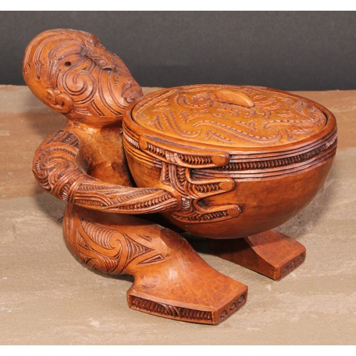 823 - A Maori figural pouaka box, carved overall with puhoro, 18.5cm wide, New Zealand