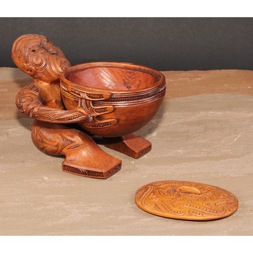 823 - A Maori figural pouaka box, carved overall with puhoro, 18.5cm wide, New Zealand