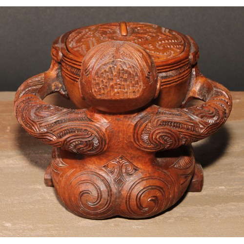 823 - A Maori figural pouaka box, carved overall with puhoro, 18.5cm wide, New Zealand