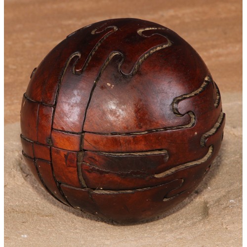 740 - Treen - a 19th century boxwood puzzle ball, approx. 7.5cm diameter