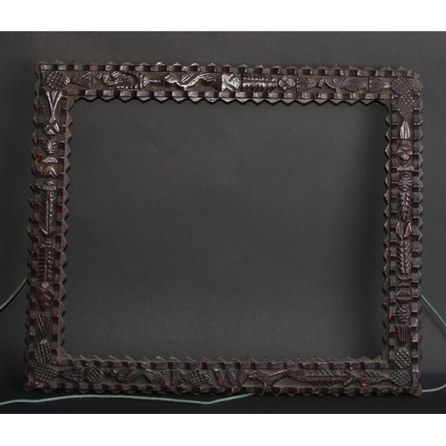 553 - Folk Art - a late 19th century tramp art picture frame, 52cm x 42cm