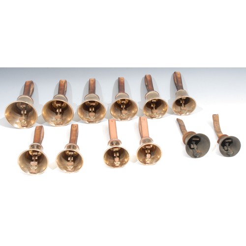 756 - A set of ten brass hand bells, by The Whitechapel Bell Foundry, the G 21cm to top of leather strap, ... 