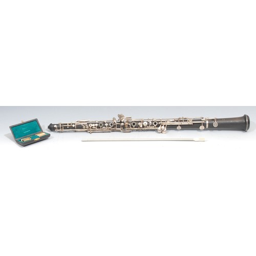 765 - An oboe, by F Lore, Paris, plated keys, no.Q18, 60cm long, cased