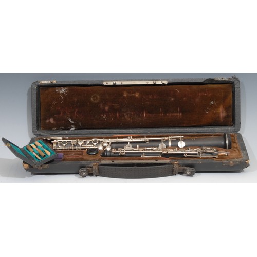 765 - An oboe, by F Lore, Paris, plated keys, no.Q18, 60cm long, cased