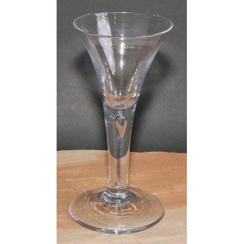 418 - An 18th century trumpet shaped wine glass, drawn stem with tear inclusion, 17cm high; a coloured twi... 