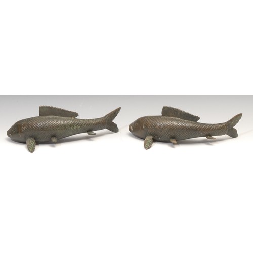 707 - Japanese School, a pair of bronze koi carp, 28cm long