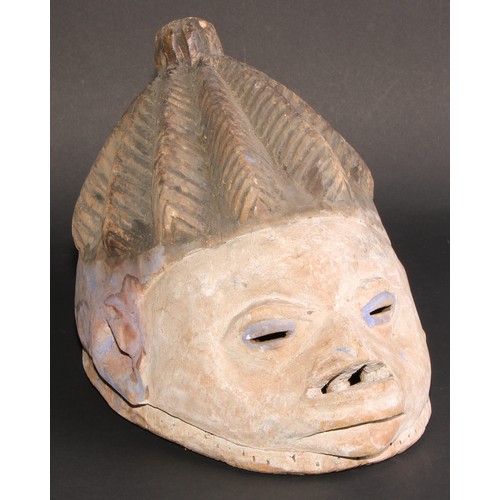 839 - Tribal Art - a Yoruba  helmet mask, decorated in blue and white pigments, Nigeria; another; etc (3)