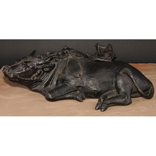 706 - A large Chinese dark patinated bronze censer, cast as an ox, 47cm wide, early 20th century