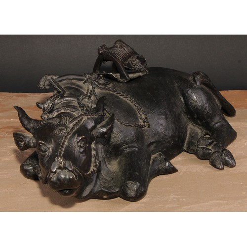 706 - A large Chinese dark patinated bronze censer, cast as an ox, 47cm wide, early 20th century