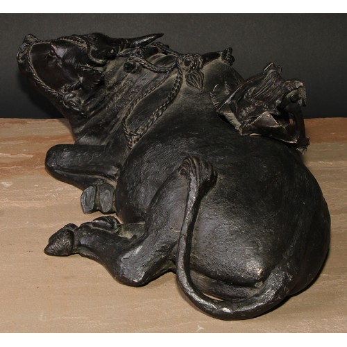 706 - A large Chinese dark patinated bronze censer, cast as an ox, 47cm wide, early 20th century