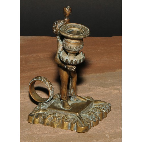 29 - A 19th century bronze figural so-to-bed, cast as a gentleman holding a campana sconce, loop handle, ... 