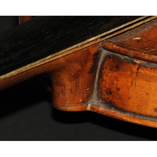 759 - A violin, the one-piece back 35.25cm long excluding button, boxwood tuning pegs, outlined with purfl... 