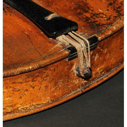 759 - A violin, the one-piece back 35.25cm long excluding button, boxwood tuning pegs, outlined with purfl... 