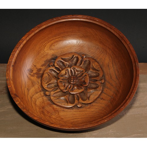 381 - A turned bowl, possibly by one of the Yorkshire Critters, the centre carved with a Yorkshire rose, 2... 