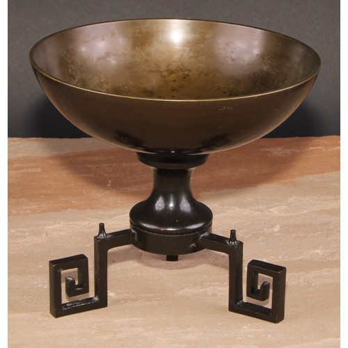 133 - A brown patinated bronze table centre tazza, tripod base with Greek key scroll feet, 18.5cm diam, le... 