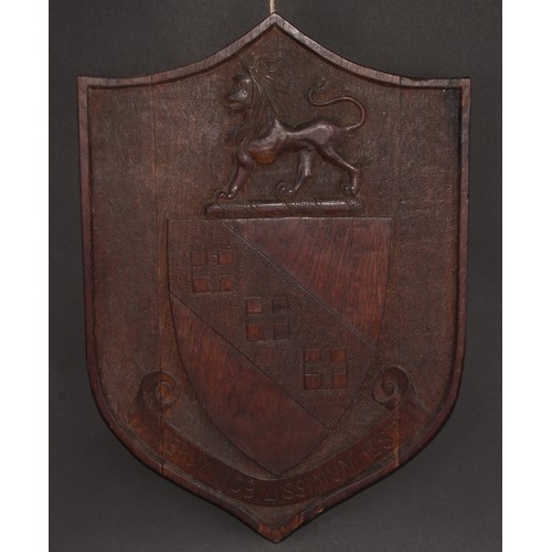 81 - A 19th century oak armorial shield, carved in relief with the arms and motto of Urwick, 42.5cm x 30.... 