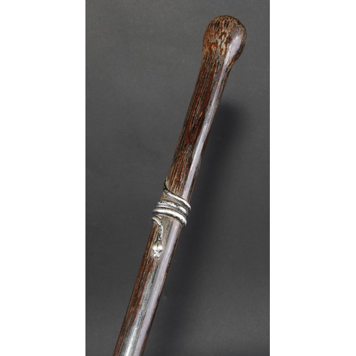 461 - An early 20th century silver coloured metal mounted palmwood walking stick, the cane entwined by a c... 