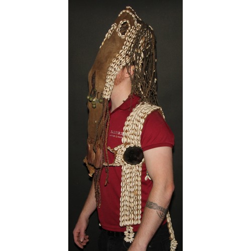 822 - A Dogon girl's helmet mask and vest, stocked with cowrie shells and 'plaited hair' applied with bell... 