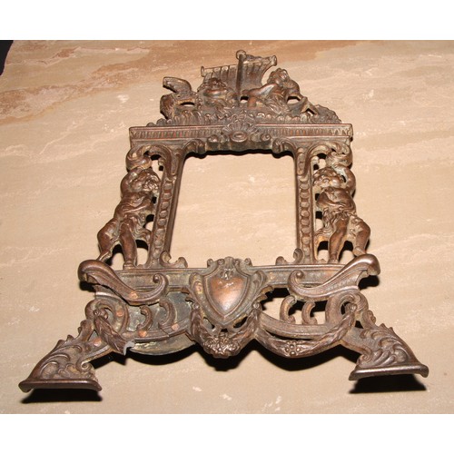 351 - A pair of Victorian cast iron photograph frames, each crested by putti rowing a boat, 37cm high, Rd.... 