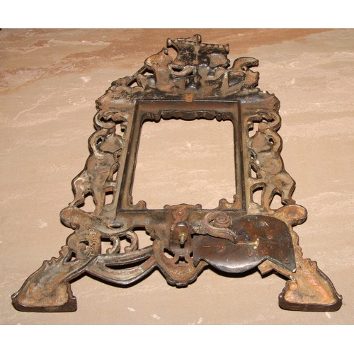 351 - A pair of Victorian cast iron photograph frames, each crested by putti rowing a boat, 37cm high, Rd.... 