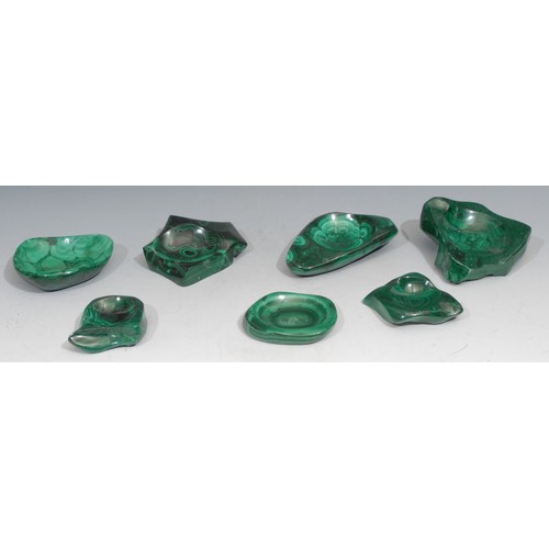 570 - Geology - Seven malachite bowls, each dished from various shapes, the largest 14cm wide, mid 20th ce... 