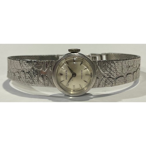 626 - A lady's 9ct white gold Rolex watch, silvered dial, baton indicators, integral textured bark bracele... 