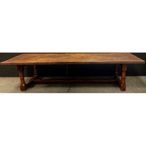 27 - A large 20th century oak refectory table, thick rectangular top, cannon barrel legs, H stretcher, 75... 