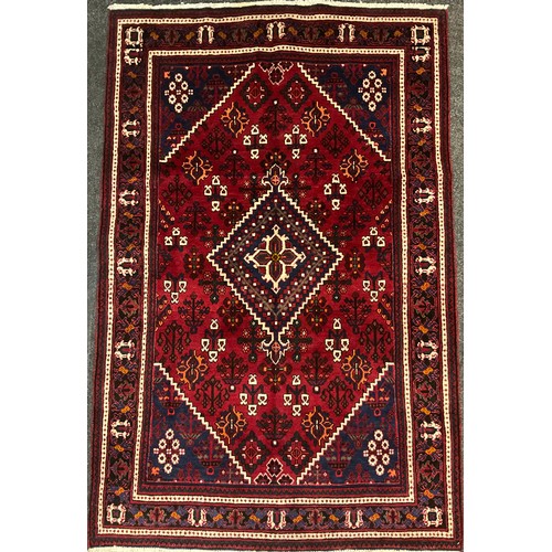 39 - A North west Persian Josheghan rug / carpet, central diamond-shaped medallion within a field of styl... 