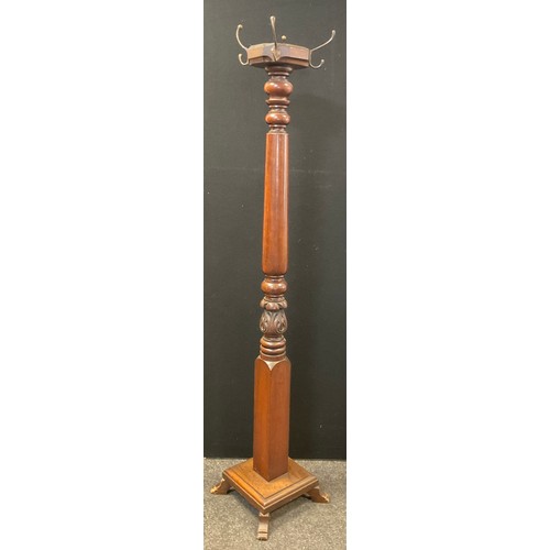 40 - A 20th century coat and hat stand, octagonal four hook top, turned and carved column, square base, o... 