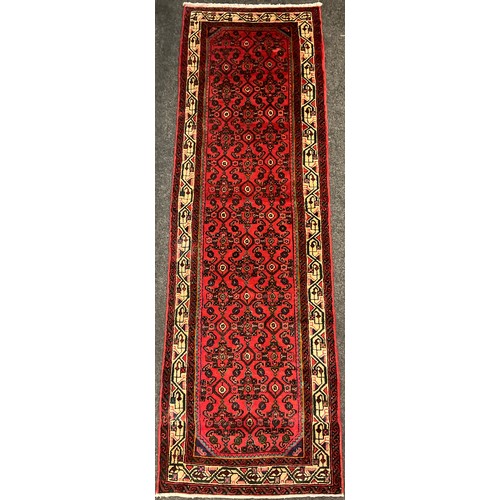 45 - A North West Persian Malayer runner, the hand-knotted field with all-over design of repeating stylis... 