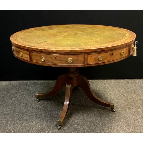 48 - A Regency style 20th century mahogany drum table, with four frieze drawers and four dummy drawers, b... 
