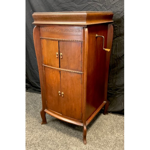 59 - An early 20th century oak cased Gilbert type 52 gramophone in cabinet, 110cm high, 52cm deep, c.1935... 