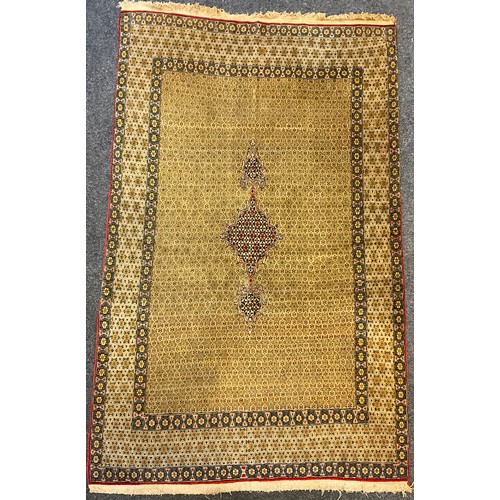 66 - A Persian Qom, or Qum rug, early to mid 20th century, silk and wool mix, typical dense knotting in s... 