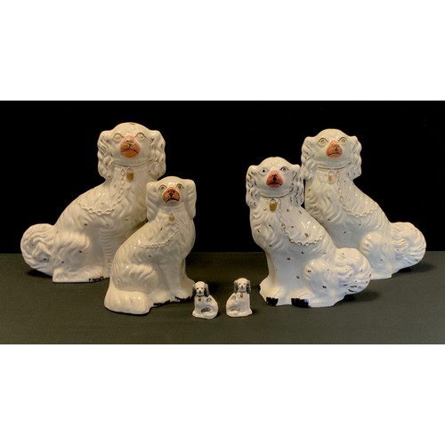 79 - A pair of Staffordshire dogs, 33cm; another similar; etc