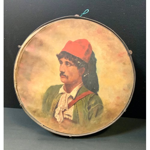 85 - An early 20th century Italian tambourine, painted with a portrait of a gentleman, 33cm diam, probabl... 