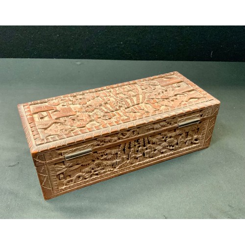 93 - A 19th century Chinese sandalwood casket, carved in the typical Cantonese manner with figures and pa... 