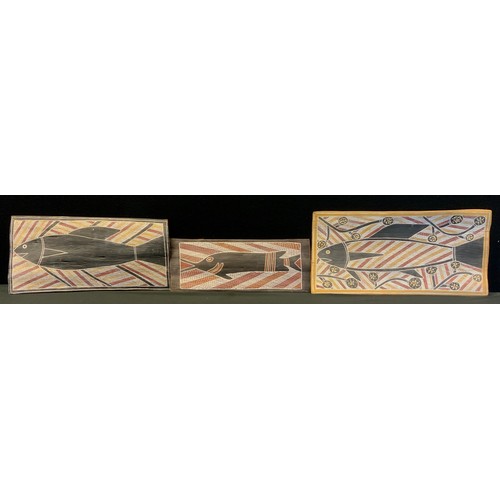 103 - Tribal Art - three mid 20th century Aboriginal bark paintings, stylised fish, largest 50cm x 24.5cm,... 