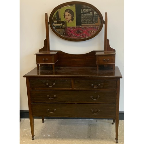 112 - An Edwardian inlaid mahogany dressing table, inlaid marquetry detailing, tapered legs, on caster ter... 