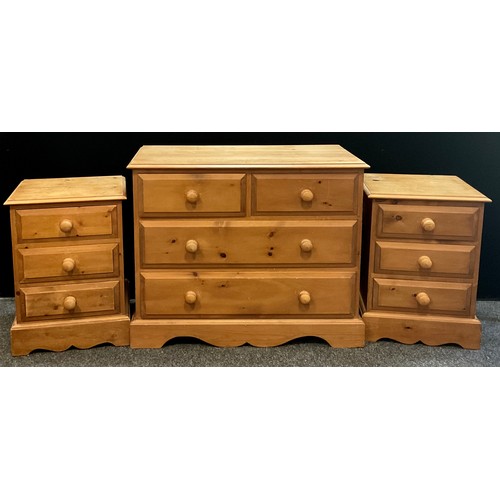 115 - A mid 20th century pine chest of drawers; over-sailing top, pair of drawers to frieze over two gradu... 