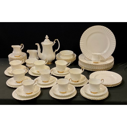 142 - A Royal Albert part 'Val 'dor' pattern table service for eight including; a tea pot, milk jug, sugar... 