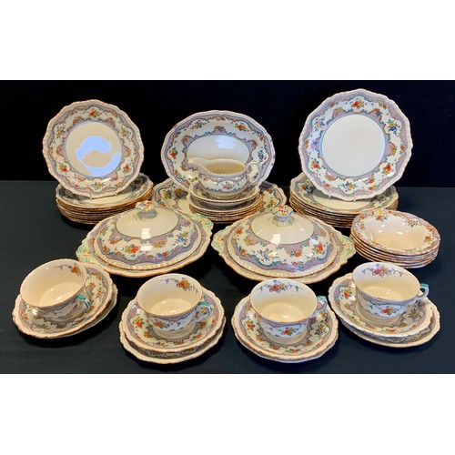 143 - A Masons dinner service for eight, decorated with a floral border including; two graduated meat dish... 