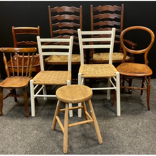 169 - A pair of rush seated ladder back carver chairs, 19th century oak child’s chair, etc.(8)