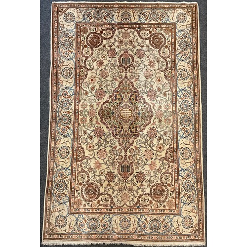 187 - A Persian Kashan rug / carpet, wool and silk mix, knotted with Navette-shaped medallion, within a fi... 