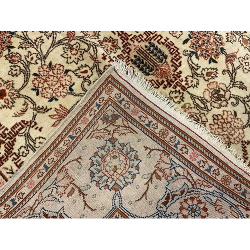 187 - A Persian Kashan rug / carpet, wool and silk mix, knotted with Navette-shaped medallion, within a fi... 