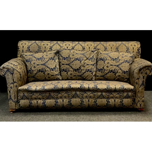 34 - An late Victorian/early 20th century three seater drop end sofa, upholstered in deep blue and gold f... 