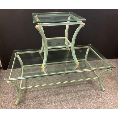 56 - A contemporary tubular green and gilt metal glass topped coffee table, green speckled curved support... 