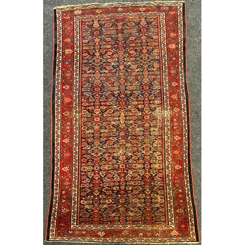 195 - A Persian Farahan rug, hand-knotted with asymmetrically patterned field, in tones of red, white, pal... 